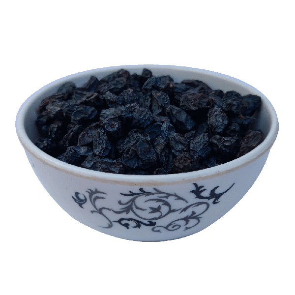 Black dry raisin in a bowl